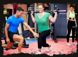 Gym Instructor and Gym Member in a Personal Training Session